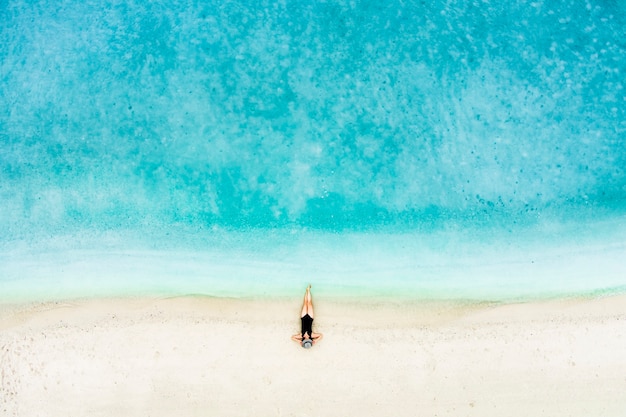 Top view of woman on the beach