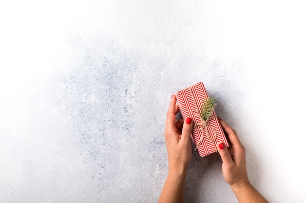 Top view of woman holding Christmas gift box