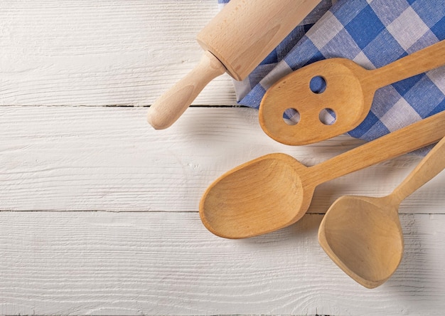 Top View of Wooden Kitchen Accessories and Towel on Natural Board Background