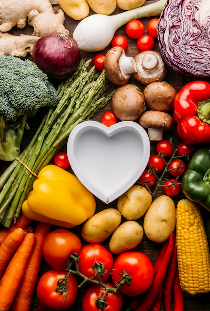 Top view of a wooden table full of vegetables