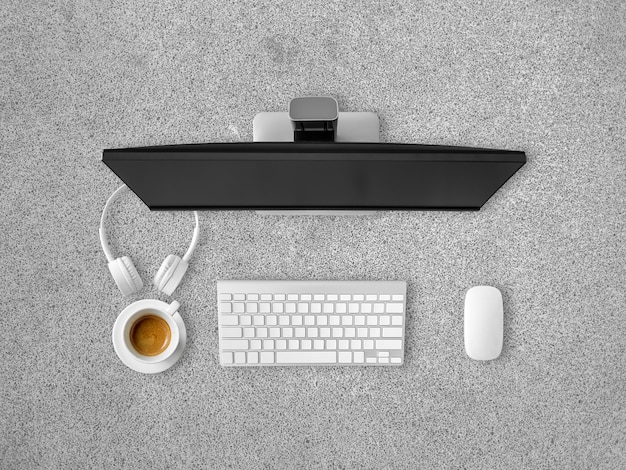 Top view of work desk with coffee headphone keyboard and mouse.