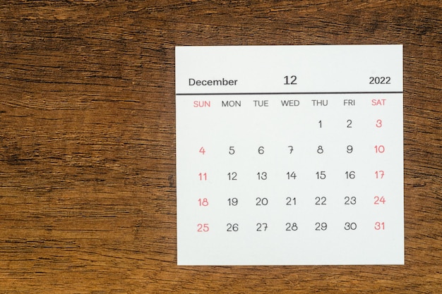 Top views Calendar desk December is the month for organizers to plan and remind on the wooden table background