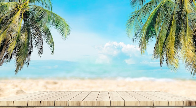 Top of wood balcony table with seascape and palm leaves sea and sky at beach