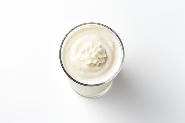 A topdown view of a vanilla milkshake sitting alone on a white background