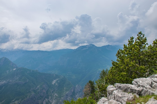 The tops of the picturesque mountains are covered with white snow