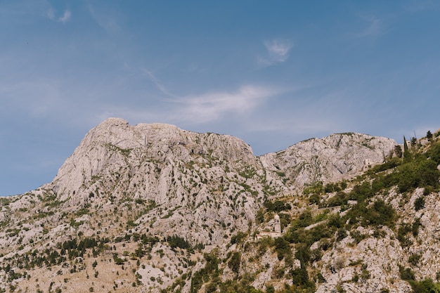 The tops of the rocky mountains in boka kotorska in montenegro in kotor bay