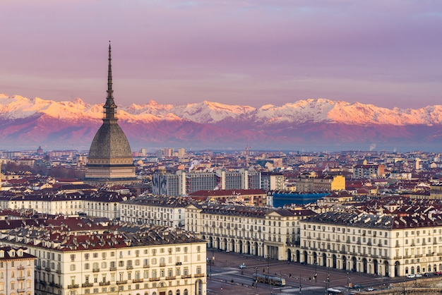 Torino (Turin, Italy): cityscape at sunrise with details of the Mole Antonelliana towering over the city.