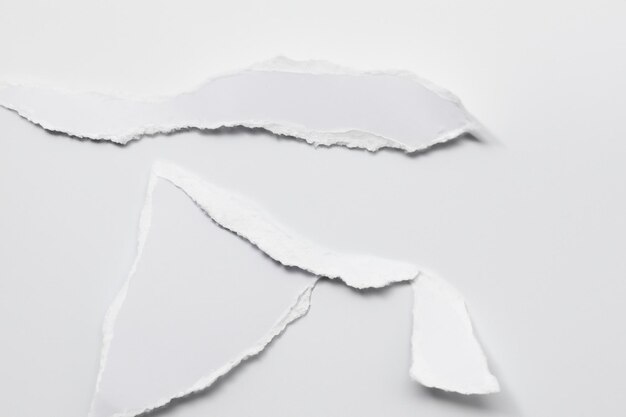 Photo torn paper as metaphor unpacking meaning and structure in a white background composition