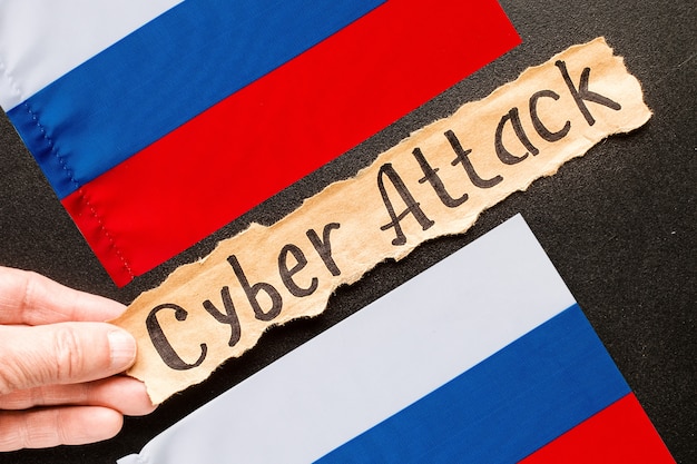 Torn paper with text CYBER ATTACK