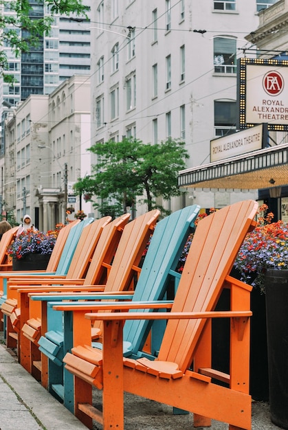 TORONTO, CANADA - 06.11.2022
Multi colored benches on King Street West in Toronto.