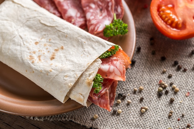 Tortilla with sausage and tomatoes