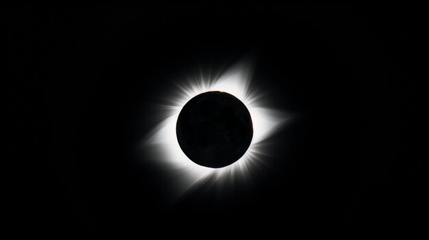 Total solar eclipse darkness sun corona moon celestial event sky monochrome