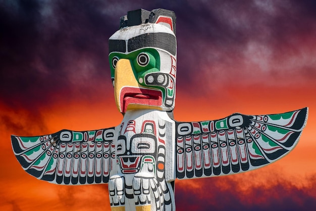 Totem wood pole in sunset background