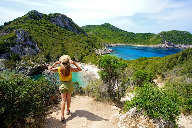 Tourism in Greece Female hiker looking amazing landscape of Porto Timoni on Corfu Island Greece