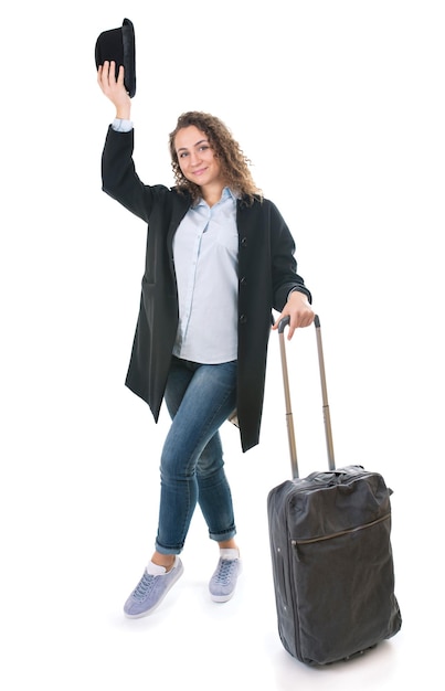 Tourism vacation young girl with travel bag ticket and passport on a white background