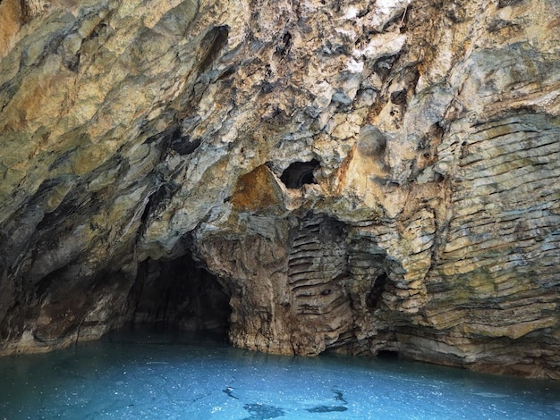 Tourist attraction. Grotto Failure in a stone rock with mineral water. City of Pyatigorsk