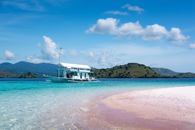 Tourist Boat in Clear Water at Pink Beach in Komodo National Park