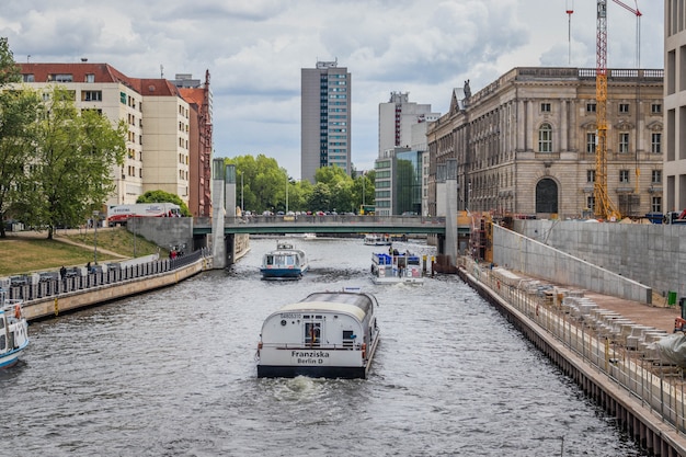 Tourist boats on river Spree, Mitte district. Berlin, Germany. Travel by Europe.