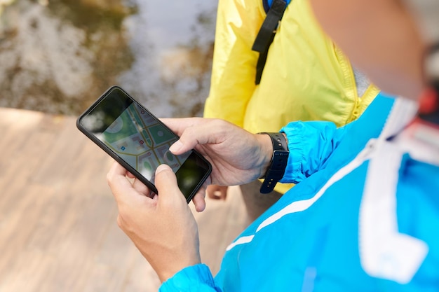 Tourist Checking Map on Smartphone