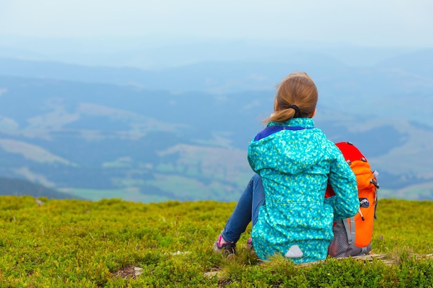 Tourist girl and mountain views, norway