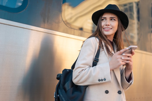 Tourist girl on the platform of railway station