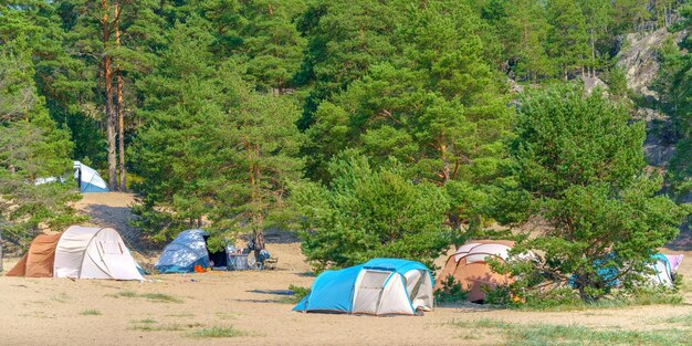 Tourist green tent on the lake Journey to the wild places of nature