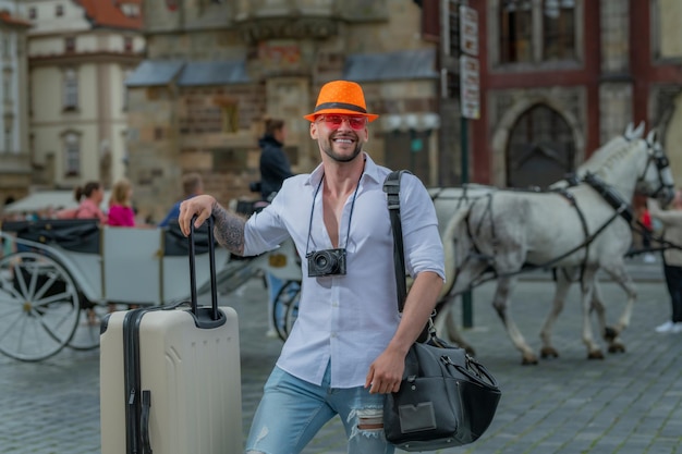 Tourist on holiday Man with luggage being ready to travel on his vacation