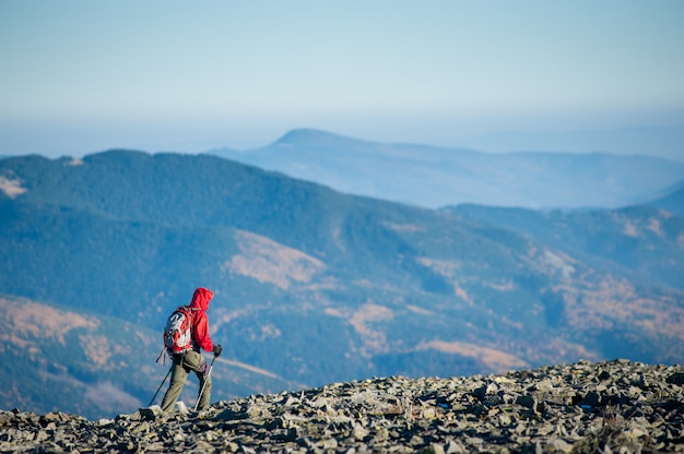 Tourist is walking on the rocky mountain plato