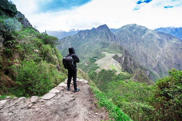 Tourist looking over Machu Picchu