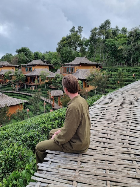 Tourist man wearing traditional clothes in Ban Rak Thai a Chinese settlement in Mae Hong Son Thailand