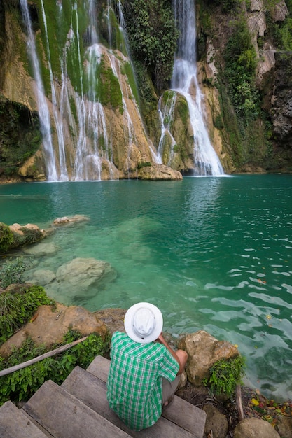 Tourist near waterfall in Mexico