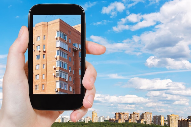 Tourist photographs of urban brick house