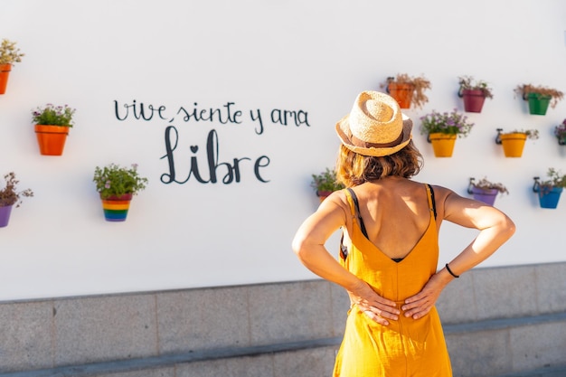 A tourist in pots with flowers with rainbow colors with lgbt colors Mijas Malaga