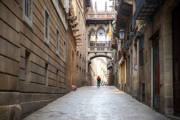 Tourist sightseeing in Barcelona Barri Gothic Quarter and Bridge of Sighs in Barcelona, Catalonia, Spain.