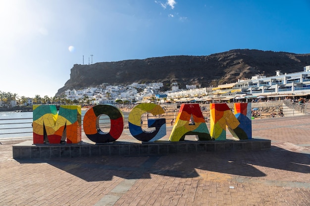 Tourist sign for the coastal town Mogan in the south of Gran Canaria Spain