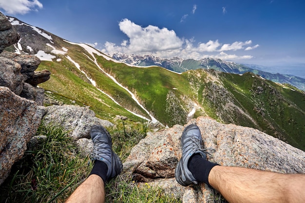 Tourist sitting on the mountain