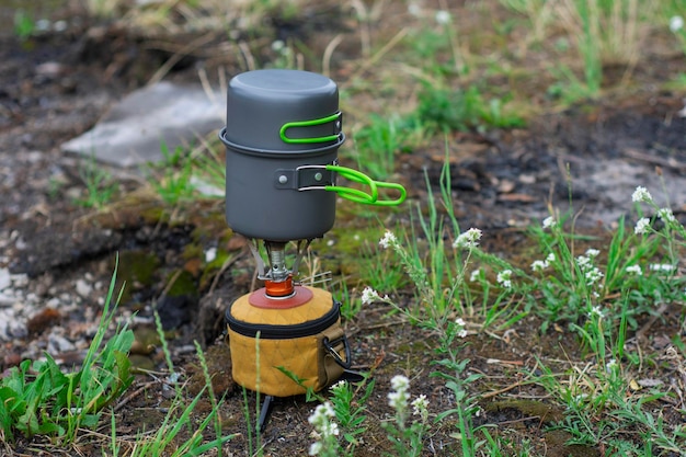 Tourist stove gas for camping and recreation on the background of nature