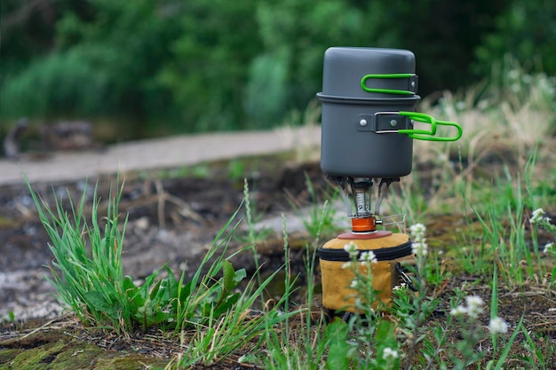 Tourist stove gas for camping and recreation on the background of nature