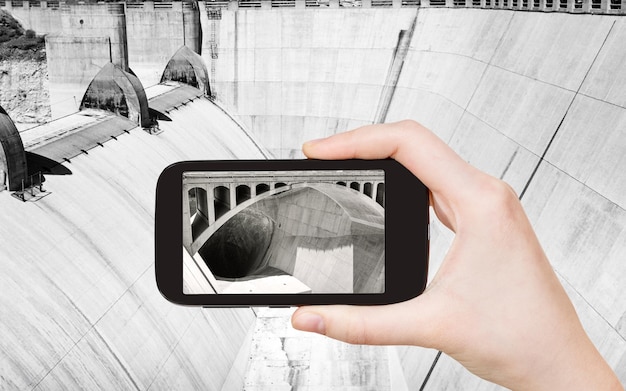 Tourist taking photo of Hoover Dam