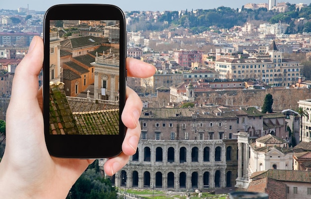 Tourist taking photo of Theatre Marcellus Rome