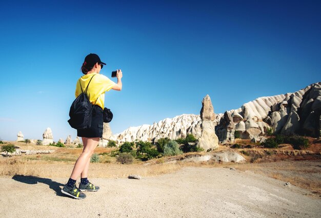 Tourist taking pictures of mountains in Turkey