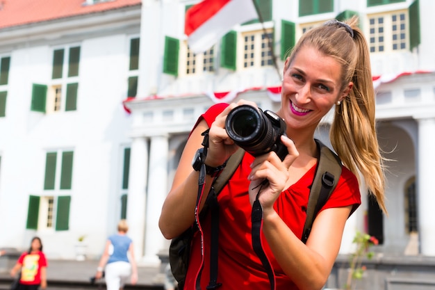 Tourist taking pictures in old batavia district ofjakarta