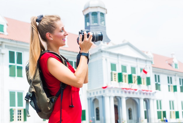 Tourist taking pictures sightseeing in Jakarta, Indonesia