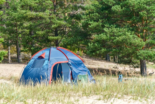 Tourist tent on the lake Journey to the wild places of nature