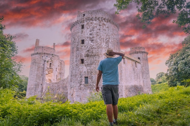 A tourist visiting the Castle of the Hunaudaye is a medieval fortress