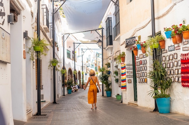 A tourist in the white houses walking in the municipality of Mijas in Malaga Andalusia