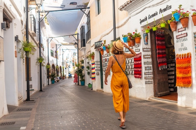 A tourist in the white houses walking and visiting the municipality of Mijas in Malaga Andalusia