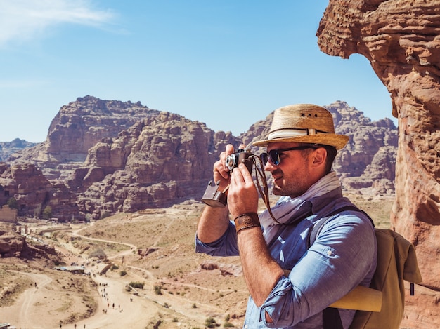 Tourist with a vintage camera. Petra, Jordan.