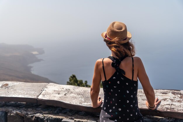 A tourist woman at the El Julan viewpoint in El Hierro Canary Islands