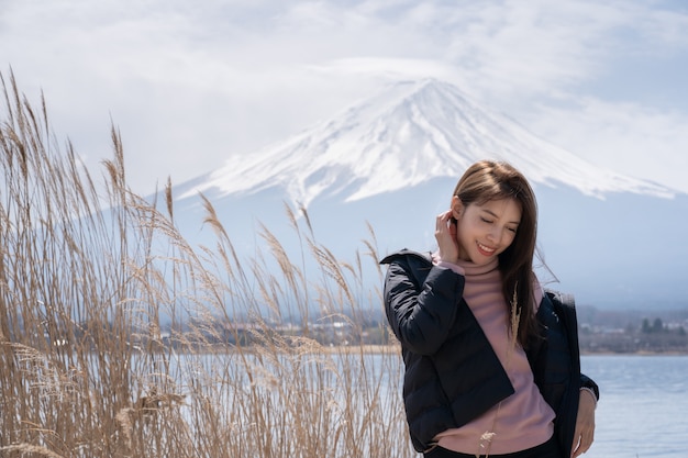 Tourist woman at Kawaguchiko lake in Japan.